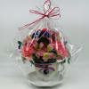 Wrapped flower arrangement in a mug with an eye design