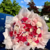 This Ramo Buchon features 12 Roses and 75 Carnations creating a show