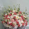 Pink and white rose bouquet in a round pink box