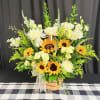 Basket arrangement of sunflowers, white roses, and white daisies