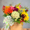 Mixed bouquet with sunflowers, gerbera daisies, and succulents in a wooden box