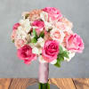 Bright pink and soft peach roses lead this Prom Night Blush flower