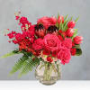 Pink and red mixed bouquet in a clear glass vase