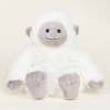 White plush stuffed animal with a gray face and feet