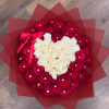 Round bouquet of red roses with a white heart of roses, wrapped in red paper with jewel accents