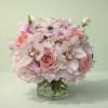 Pink and white floral bouquet in a clear glass vase