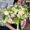 Large bouquet of white roses and green chrysanthemums with eucalyptus