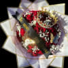 Red rose bouquet with a crown and decorative wrap