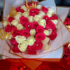 Bouquet of pink and white roses with gold butterfly picks