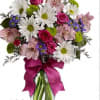 Bouquet of white daisies, pink roses, and pink alstroemeria in a glass vase