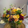 Fresh fall flowers hand designed perfect to go on a desk or