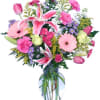 Pink and purple mixed bouquet in a clear glass vase