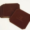 Protect your surfaces in style with this set of chic leather coasters.