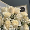 Bouquet of cream roses with small white filler flowers