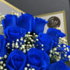 Bouquet of vivid blue roses with white baby's breath