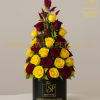 Tall arrangement of yellow and burgundy roses in a black box
