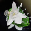 White orchid accented with silver bullion and silver jewels can also be