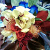 protea, cymbidium and blue roses are the perfect and a unique mix