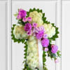 White and Lavender Sympathy Cross. White flowers surrounded by foliage and a