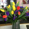 bright, bold and beautiful tulips arranged in a vase.