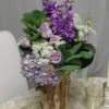 This vase of Lavender and White floral product (Stock, Roses, Queen Ann&#039;s