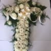 Cross created with assorted size roses and beautiful greens 
