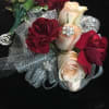 Beautiful rose and carnation corsage embellished with diamond accents and jewels on