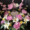 Large pink silk arrangement with ceramic heart.