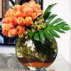 This gorgeous arrangement includes about 25 south American orange roses, 15 to