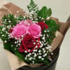3 pink and 3 red large roses with baby&#039;s breath, and greenery