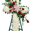 Commemorate fidelity with this standing spray cross of white blossoms adorned with