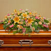 Pay your respects with a divine mix of pink and yellow blossoms