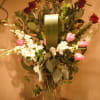 Vase design of lush and beautiful roses and orchids. Let your loved