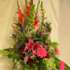 An elegant mixture of spring flowers to brighten any location.  Traditional