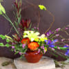 Mixture of spring flowers designed with a horizontal view.  great centerpiece