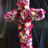 A beautiful cross full of flowers for your loved one.