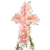 This beautiful pink cross features roses and pastel stock to create a