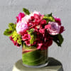 Hydrangea, Roses, Scented Geranium, Peonies (if available)Tropical Leaves, Cymbidium Orchids.