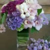 Green hydrangea, tulips,  sweet peas, tropical orchids, daliahs and hyacinth 