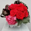 red roses, hydrangeas and tropical leaves