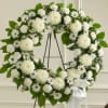  This white Standing Wreath is a tasteful reflection of the respect