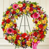  This hand-designed Standing Wreath in elegant bright hues is a beautiful
