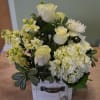 Hydrangea, Roses, Spider Mums, Stock and more in this beautiful arrangement that