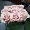Blush roses in a low square chrome container. (9stems)