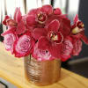 2 dozen roses with cymbidium orchids in a round brushed rose gold