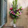 A taller piece consisting of hydrangea, roses, peonies(if seasonally available), calla lilies