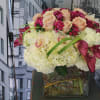 In this arrangement Hydrangea, Calla Lillies, Orchids, Roses and sweet Williams are