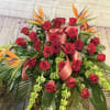 Casket spray with tropical birds of paradise. Vibrant selection of flowers