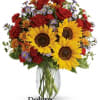 A sunny sunflower bouquet gets an autumnal spin with the addition of