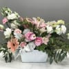 A basket of premium pink and white flowers will show your loved
